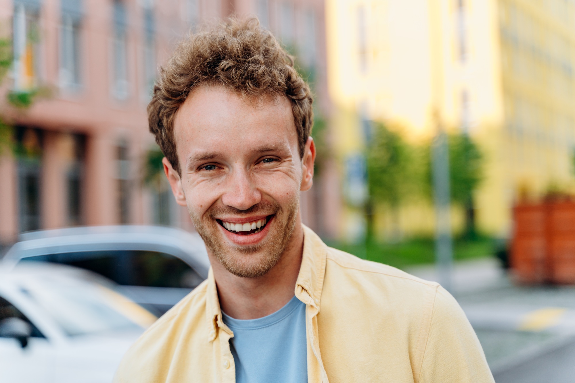 Handsome young man on the background of the city.